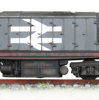 58029 showing the dappled fading effect on the panels and paint peeling on the underframe. 