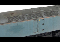 A picture of 47816 showing a full respray into FGW in it's final days and one end converted to a flush front. The loco has been heavily faded with bleached paintwork and special effects of patch paintwork and rust. Base model has been converted to a cutaway buffer beam example with etched kick plates and modified battery box. Other details include: detailed buffer beam at one end and semi detailed at coupling end, driver fitted, moulded nose handrails replaced with wire, renumbered, moulded roof grills replaced with etched fan and grill, body lowered, finer ariels, and nose catch added