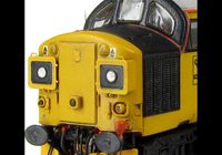 A picture of 37025 with plated over boiler port and steps with respray of blue and black with cantrail added. Other details include: nose catch, snowploughs, etched nameplates, bogie modification to reduce gap between body and bogies, driver and second man, finer aerials, renumbered, speedo cable, etched 3D roof grill and fan, etched headcode surrounds and nose horn covers, double detailed buffer beam at one end and semi detailed at coupling end.
