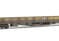 A picture of Heavilly weathered with extension of the yellow and variation in yellow shade where slats have been replaced.