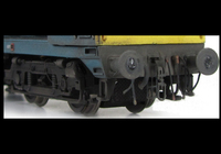 A picture of Close up of detailed buffer beam, squared off buffer and speedo cable on bogies.